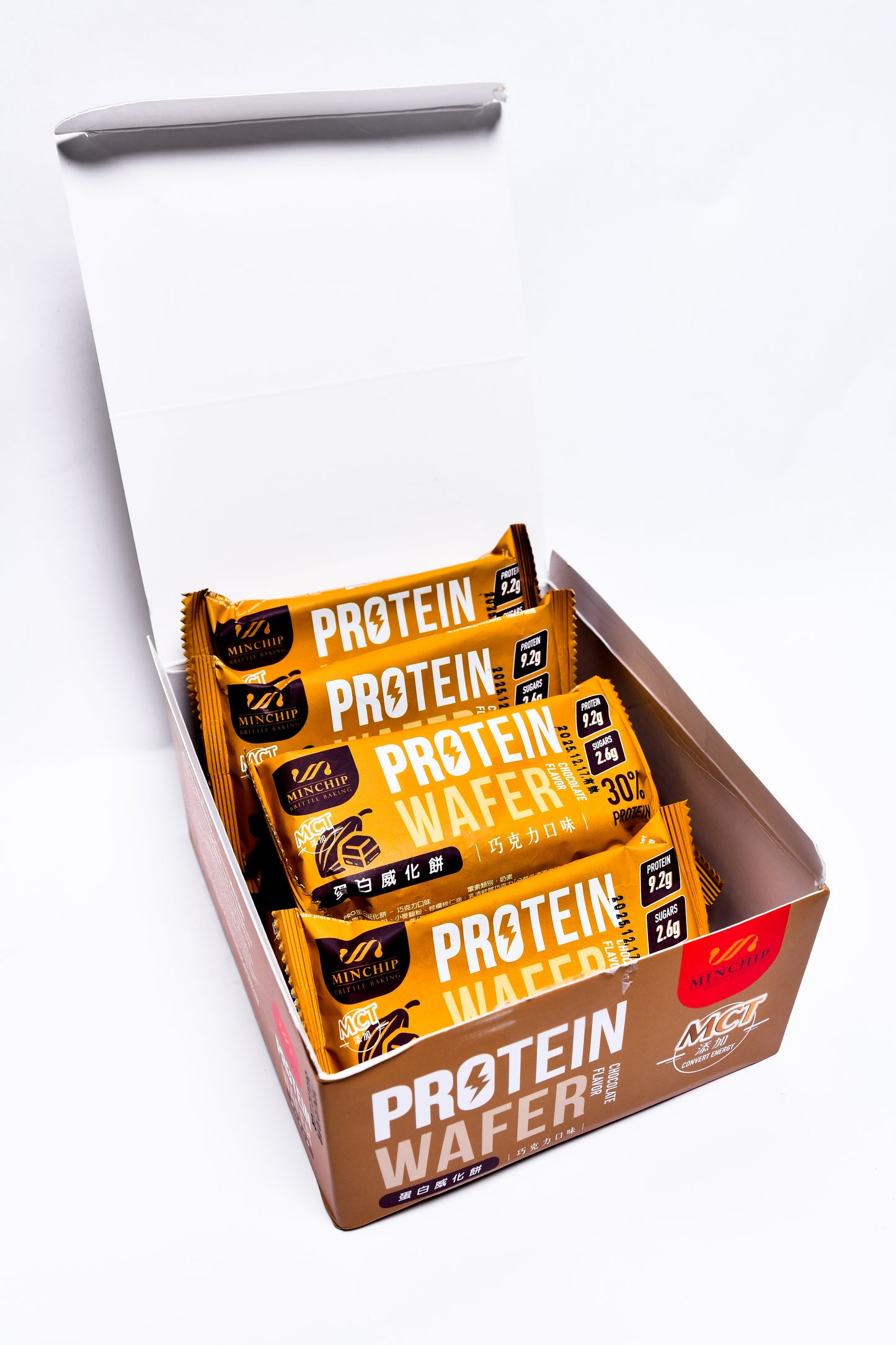 Box of exotic Protein Wafer bars with yellow and brown packaging on a white background